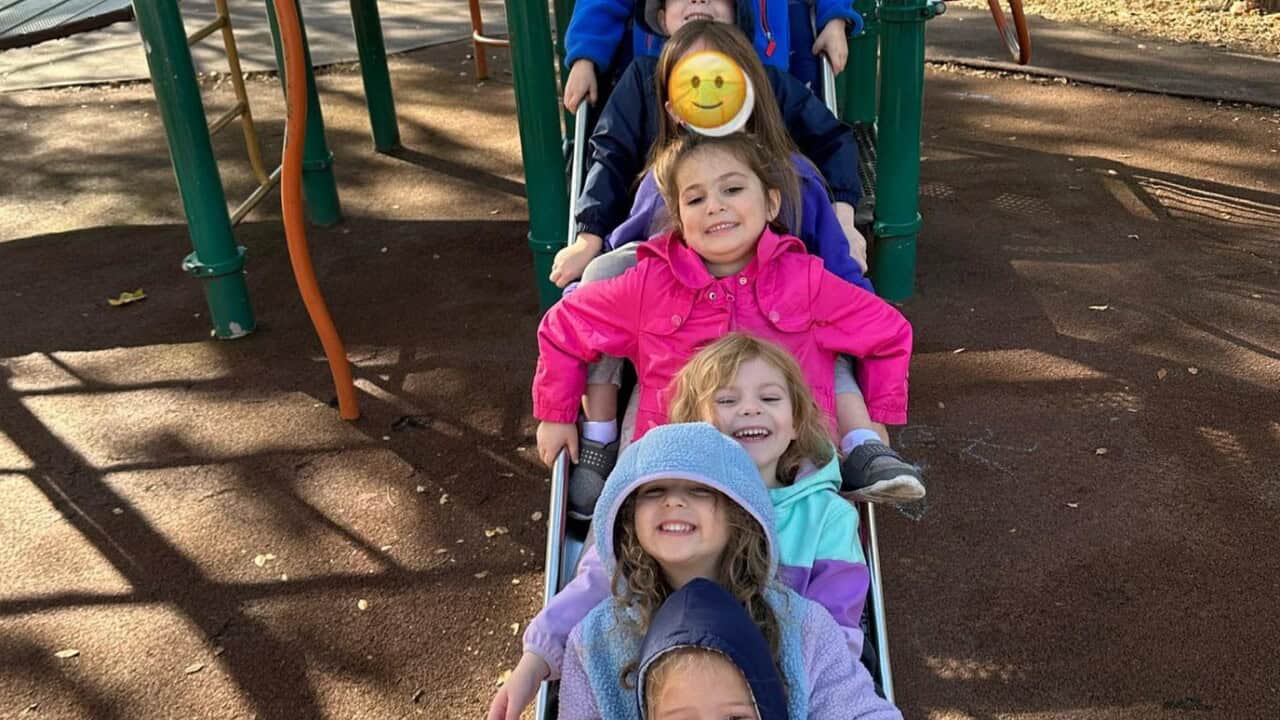 Kids going down a slide.