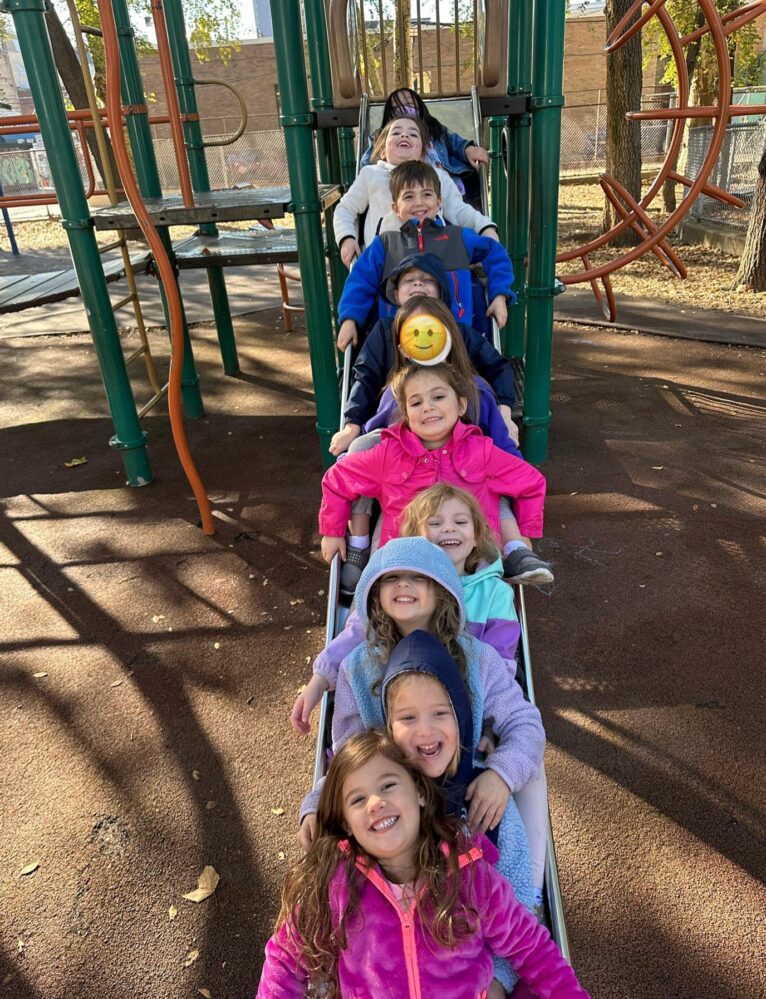 Kids going down a slide.