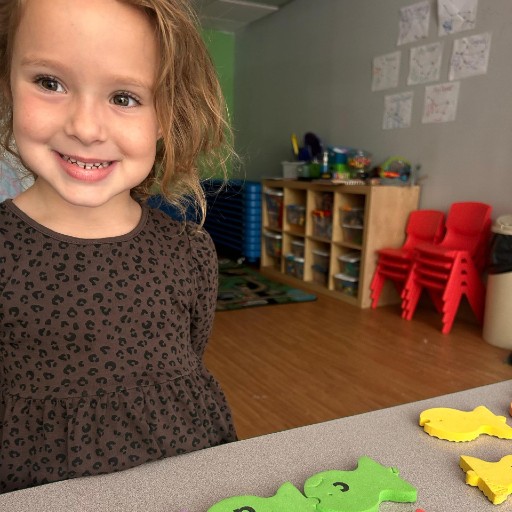 Little girl smiling for photo.