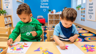 Children participating in a hands-on learning activity at The Giving Tree Daycare Logan Square